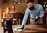 waiter in mask cleaning table