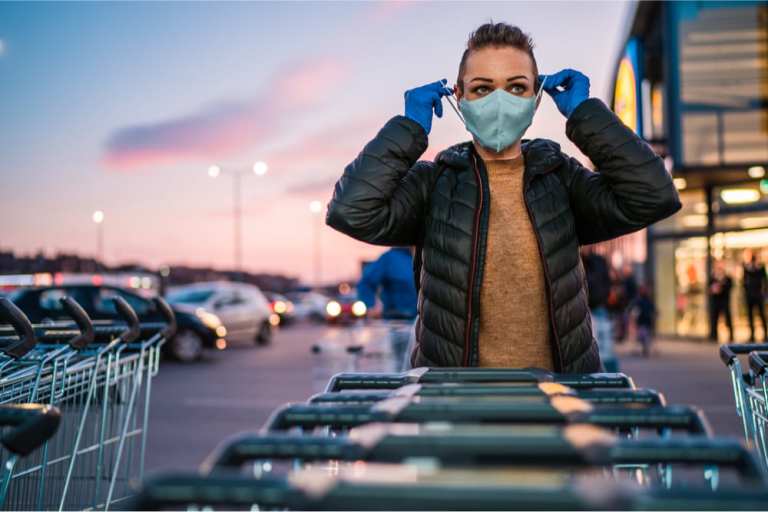 shopper putting on face mask