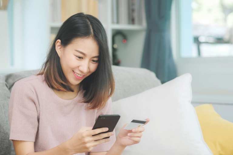 woman online shopping with smartphone