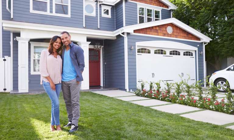 young couple with house