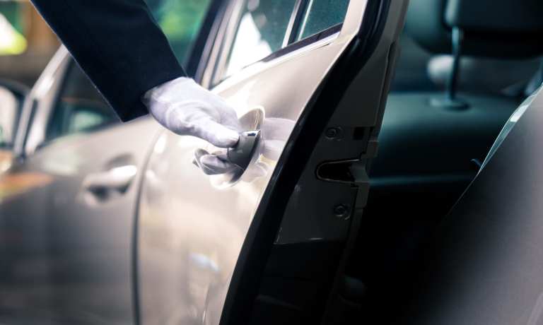 chauffeur opening car door