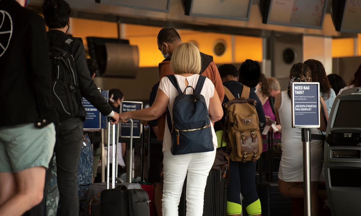 Travel Numbers Surge, Leading To Long Airport Wait Times