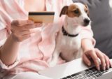 woman with credit card and dog