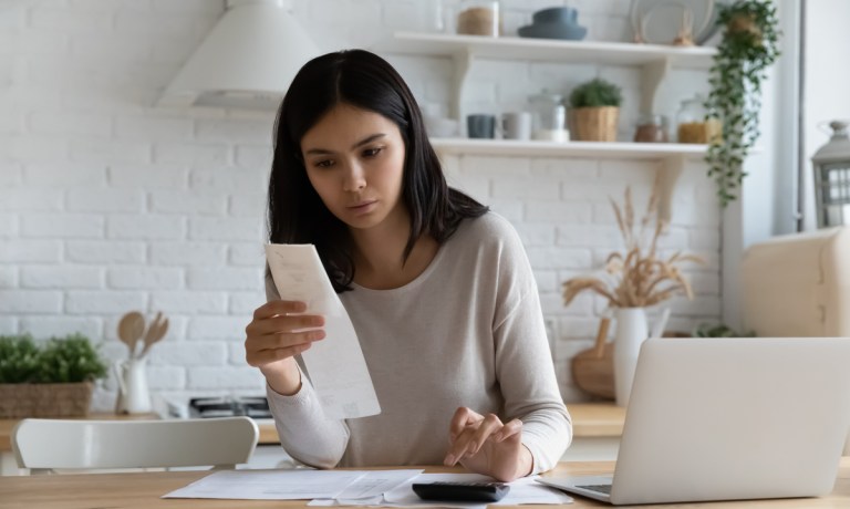 woman looking at bills