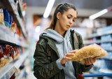 woman checking grocery price