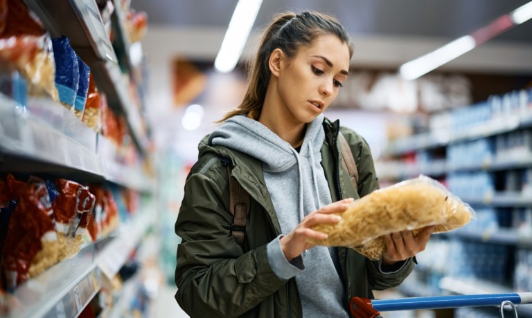 woman checking grocery price