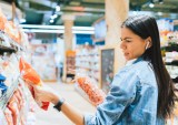 grocery shopper checking product