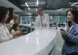 woman paying at medical office