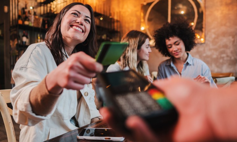 woman spending with credit card