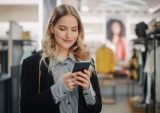 woman texting in store