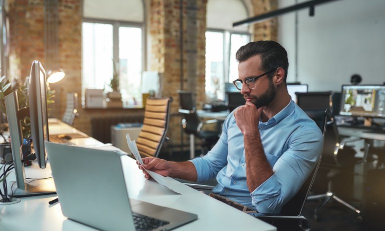 businessman looking at numbers