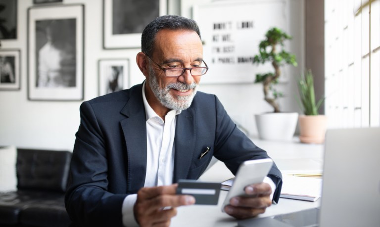 man using credit card to pay online