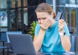 upset woman at laptop