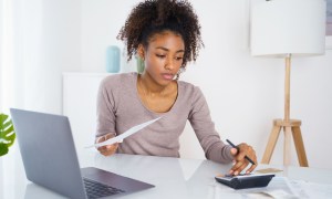 young woman paying bill