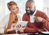 couple looking at digital tablet