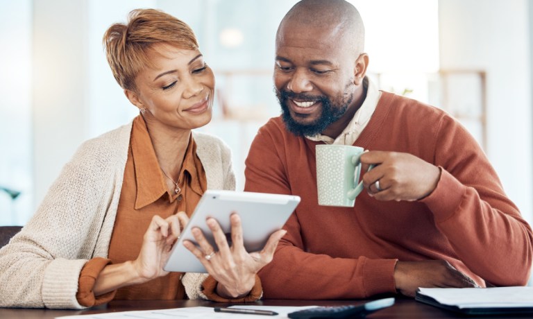 couple looking at digital tablet