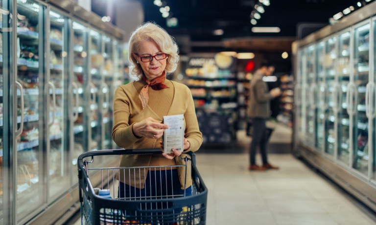 consumer checking list in grocery store