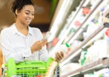 woman using smart phone app in store