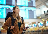 woman at airport with ticket