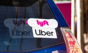 Lyft and Uber stickers on car