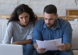 couple looking at budget, bills