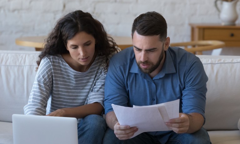 couple looking at budget, bills