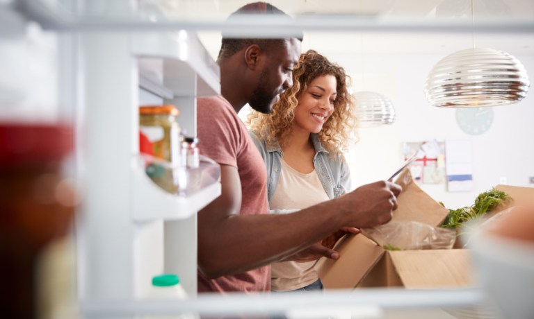 couple opening meal kit