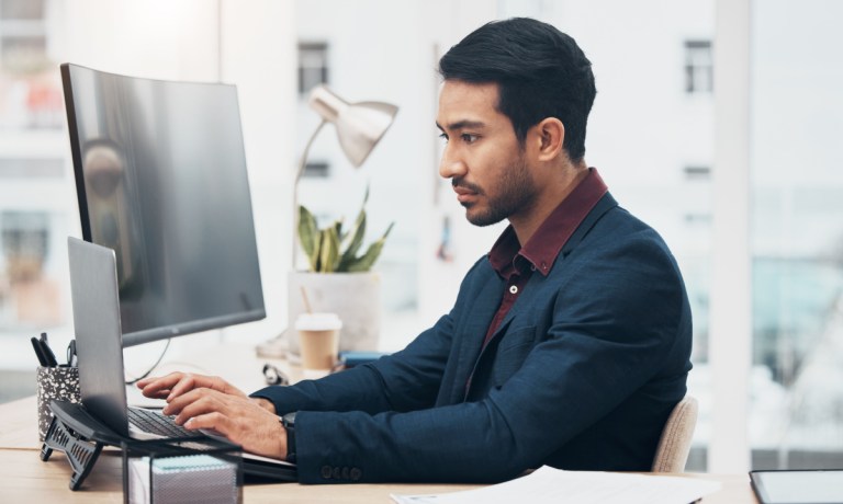 man working at laptop