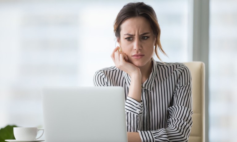 annoyed woman at laptop