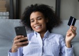 young woman shopping online with phone