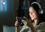 woman streaming movie on smartphone