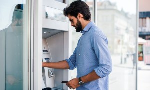 man using ATM