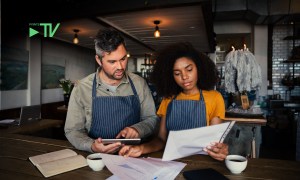 small business owners looking at finances