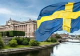 Swedish Parliament building and flag