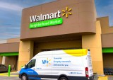 Walmart store with Walmart Plus van in front