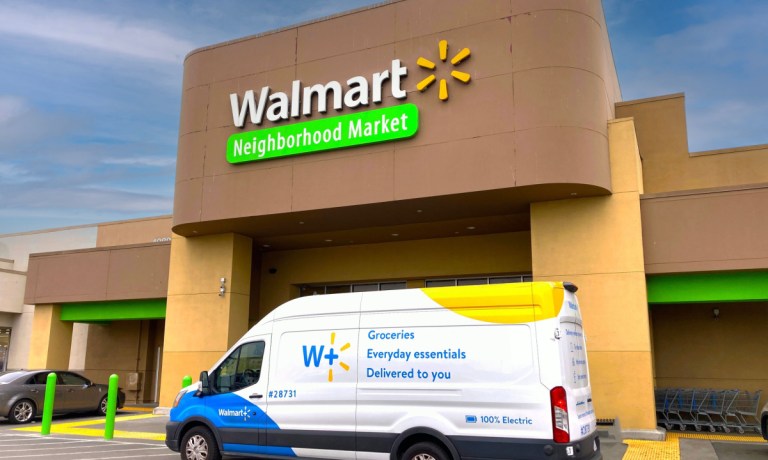 Walmart store with Walmart Plus van in front