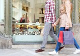 couple walking with shopping bag