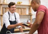 man paying with credit card