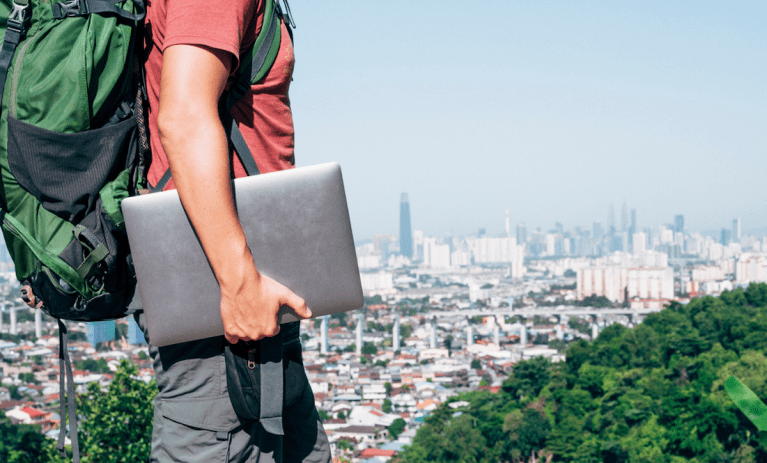 traveler with backpack and laptop