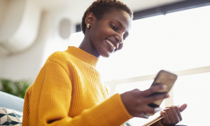 woman paying on smartphone