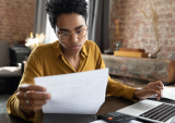 woman looking at papers