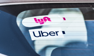 Lyft and Uber stickers on car