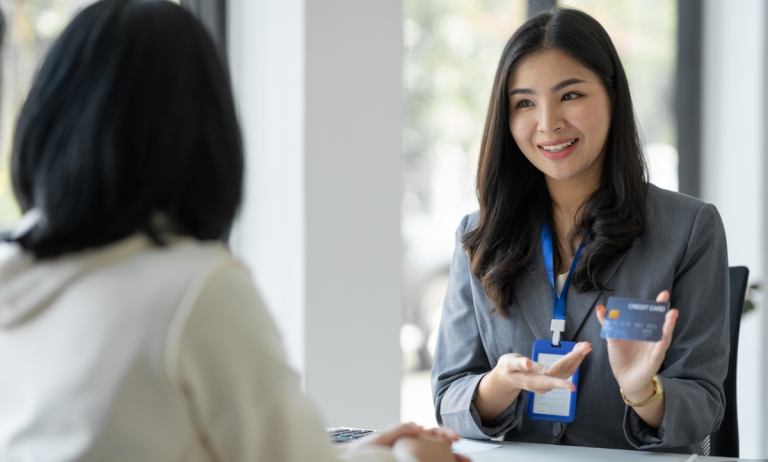 banker issuing credit card to customer