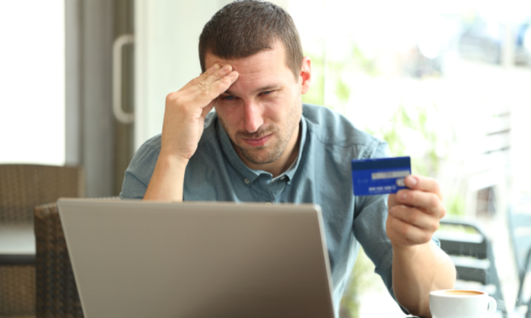 frustrated man at laptop, fraud