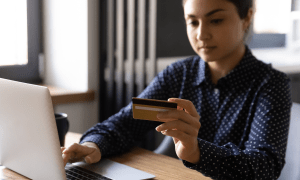 woman paying online with card