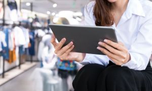 woman in retail store with tablet