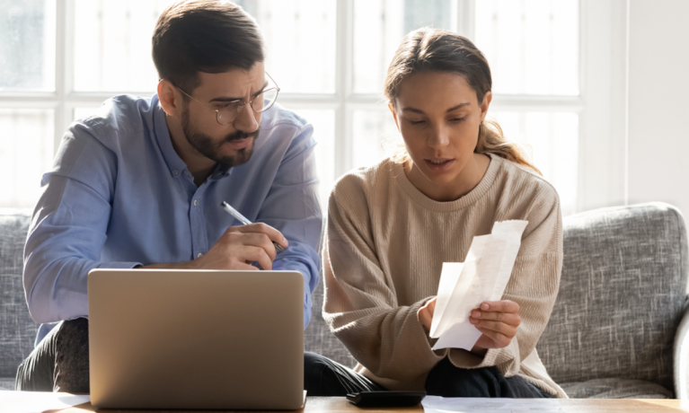 couple looking at bills