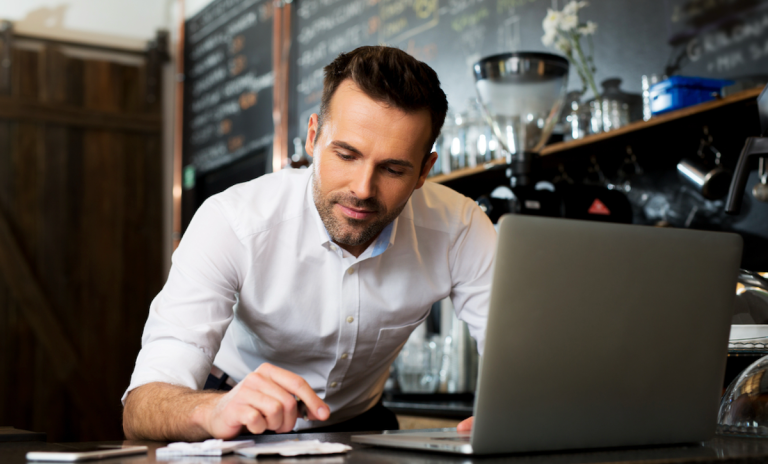 restaurant owner at laptop